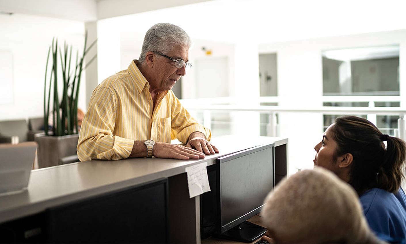 A patient complaining at a hospital service desk